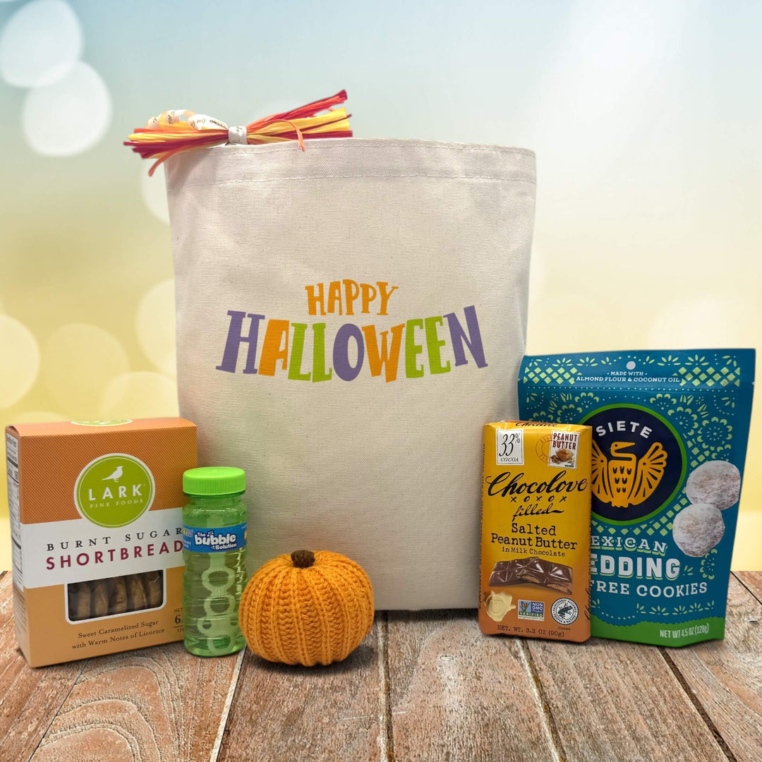 Halloween gift basket with cookies, bubbles, knit pumpkin, chocolate bar, and mexican cookies