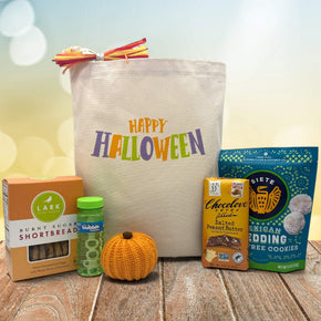 Halloween gift basket with cookies, bubbles, knit pumpkin, chocolate bar, and mexican cookies
