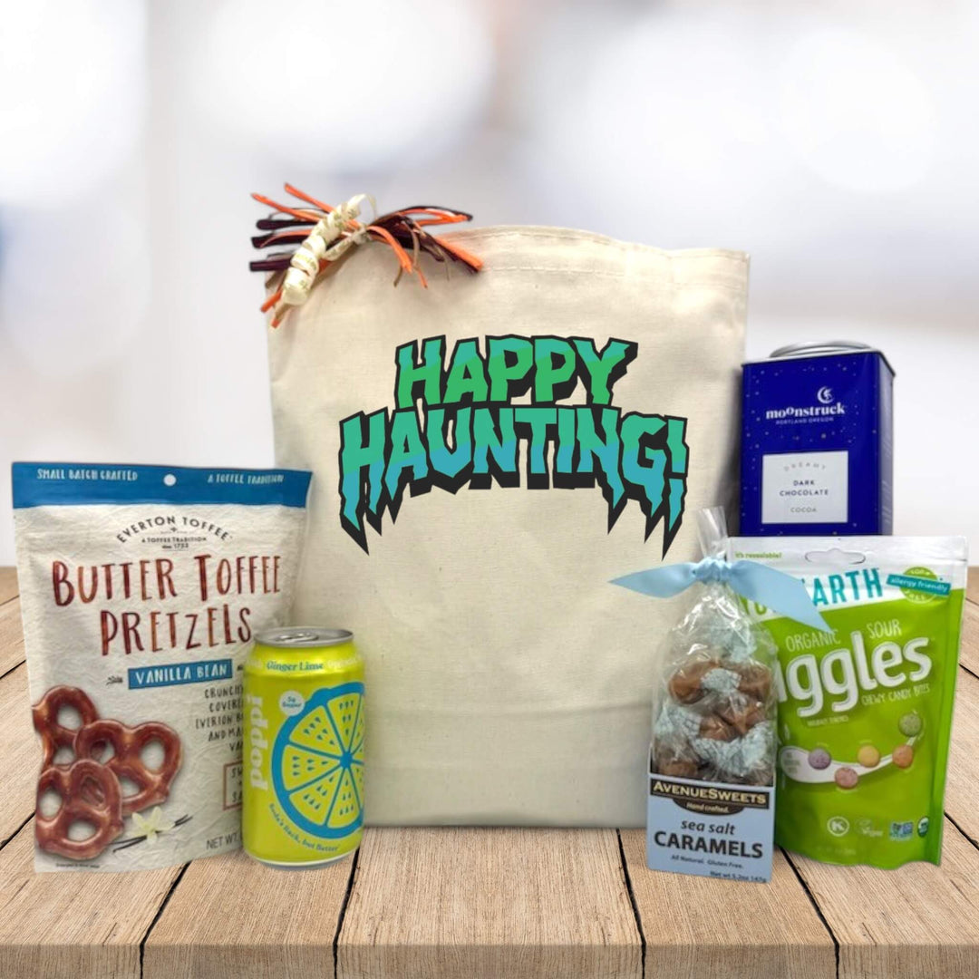 happy haunting gift basket with toffee pretzels, poppi, caramels, cocoa and candies.