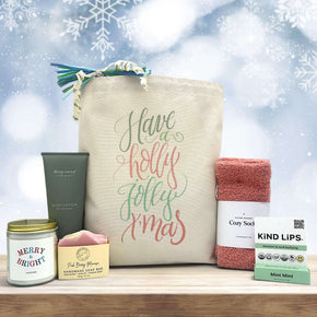 gourmet holiday gift basket with a large candle, soap, lotion, socks and chapstick