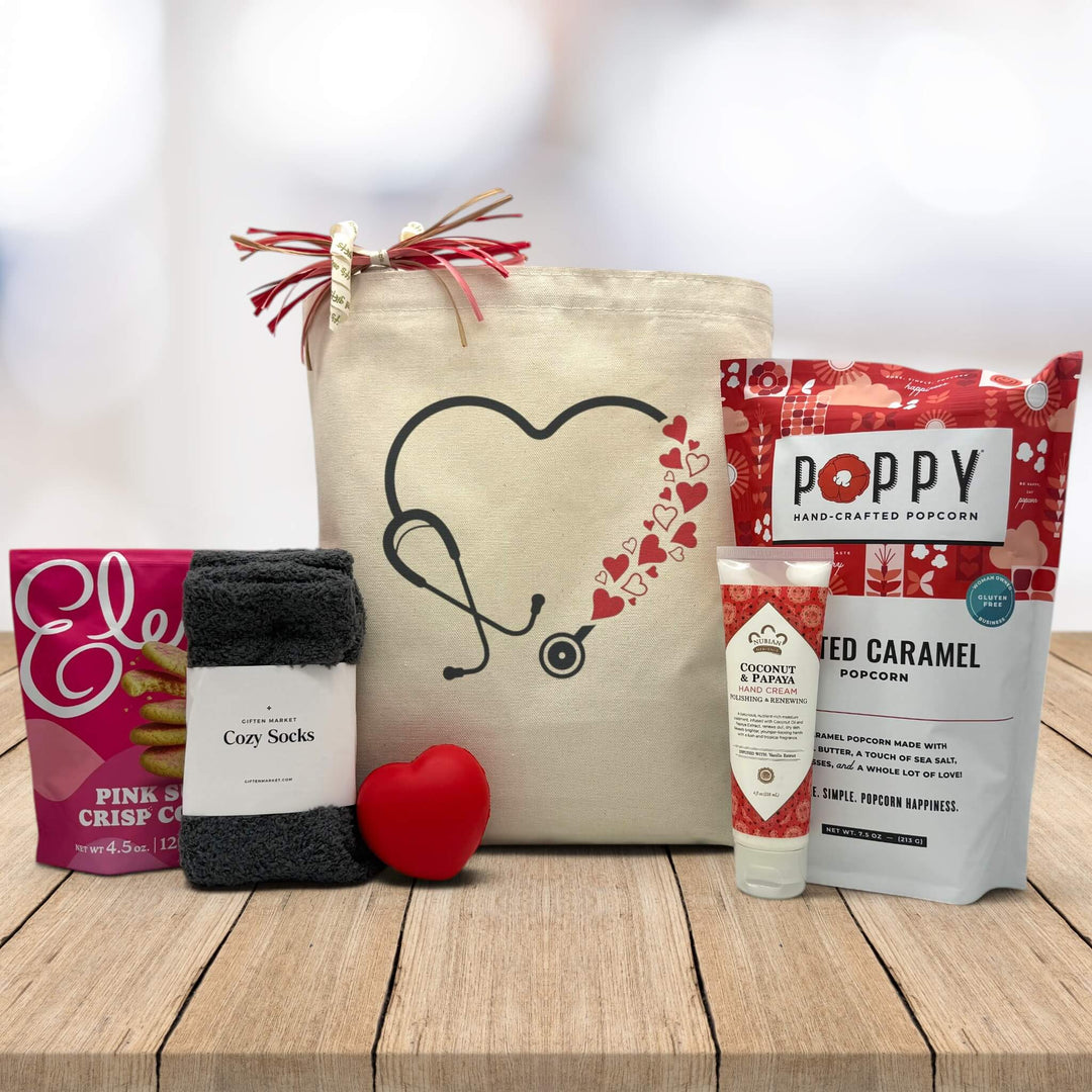 black stethoscope with hearts on a canvas bag, with cookies, socks, heart squeeze, lotion and popcorn