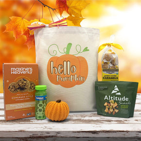 Gourmet Fall gift basket with peanut butter cookies, bubbles, a knit pumpkin, trailmix and caramels