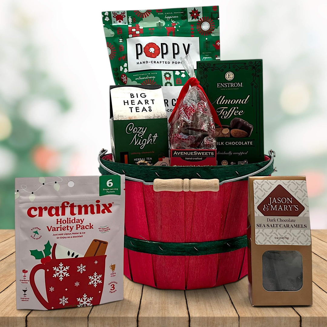 Gourmet holiday gift basket with popcorn, almond toffee, peppermint caramels, tea, a craft mix and sea salt caramels