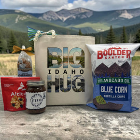big idaho hug with a lake and mountain inside big hug, with snacks sitting on a table