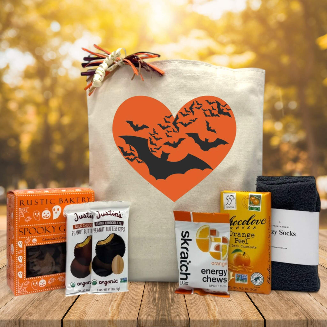 halloween gift basket with cookies, justins peanut butter bar, energy chews, chocolate, and socks