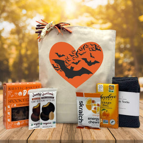 halloween gift basket with cookies, justins peanut butter bar, energy chews, chocolate, and socks