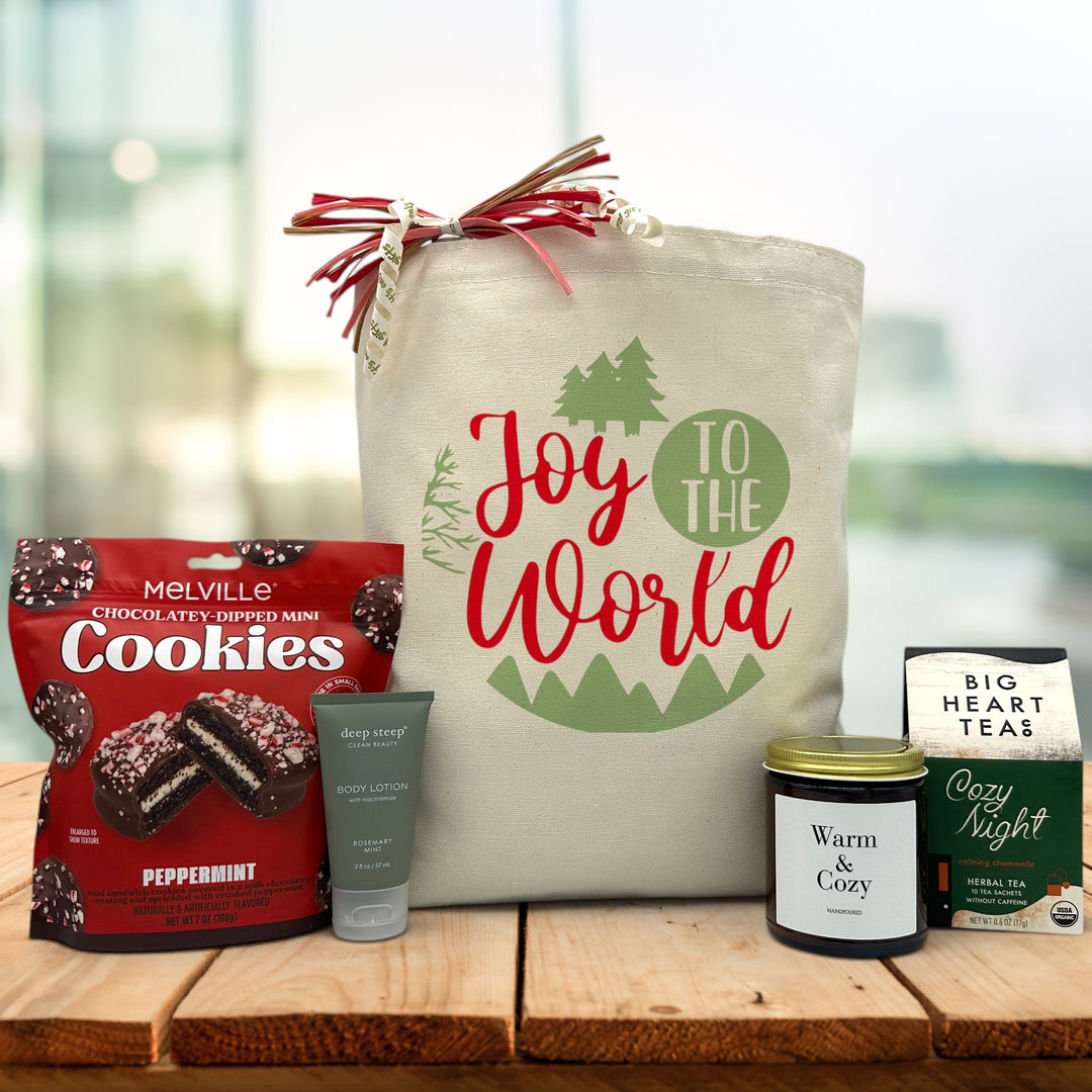 Gourmet holiday gift basket with peppermint cookies, lotion, a large candle and tea