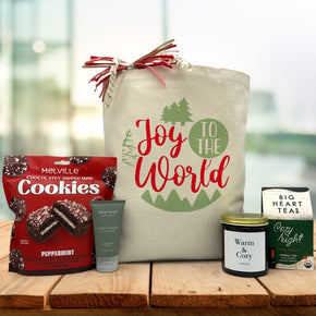 Gourmet holiday gift basket with peppermint cookies, lotion, a large candle and tea