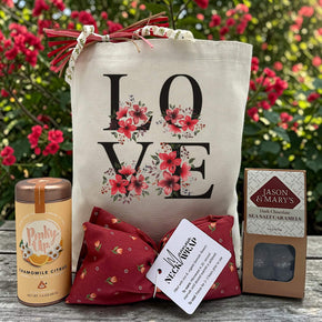 floral love gift with tea, a neck wrap, and caramels