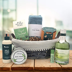 Gourmet nurses gift with tea, socks, a plant grow kit, lotion, a candle, chapstick, and bubble bath