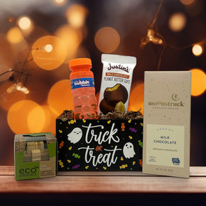 Mini Halloween gift basket with a puzzle, bubbles, justins peanut butter cup and a moonstruck milk chocolate bar