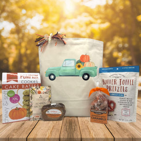 teal truck with pumpkins printed on canvas tote bag with cookies, chai, bread, caramels and pretzels