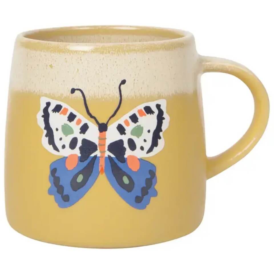 yellow mug with a colorful butterfly in the middle 