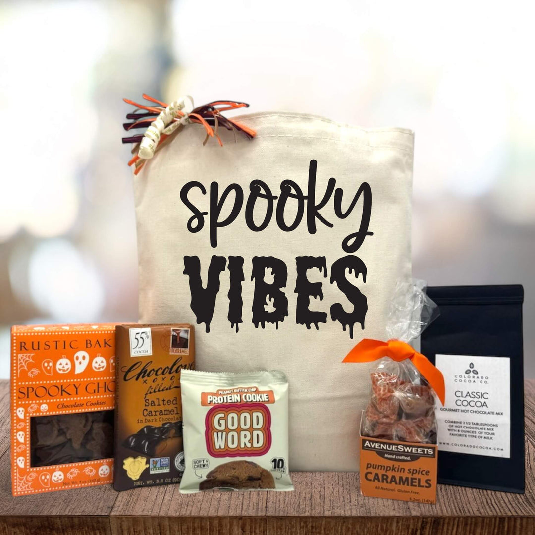 Halloween gift basket with cookies, chocolate bar and cookie, caramels and pumpkin cocoa