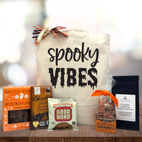 Halloween gift basket with cookies, chocolate bar and cookie, caramels and pumpkin cocoa