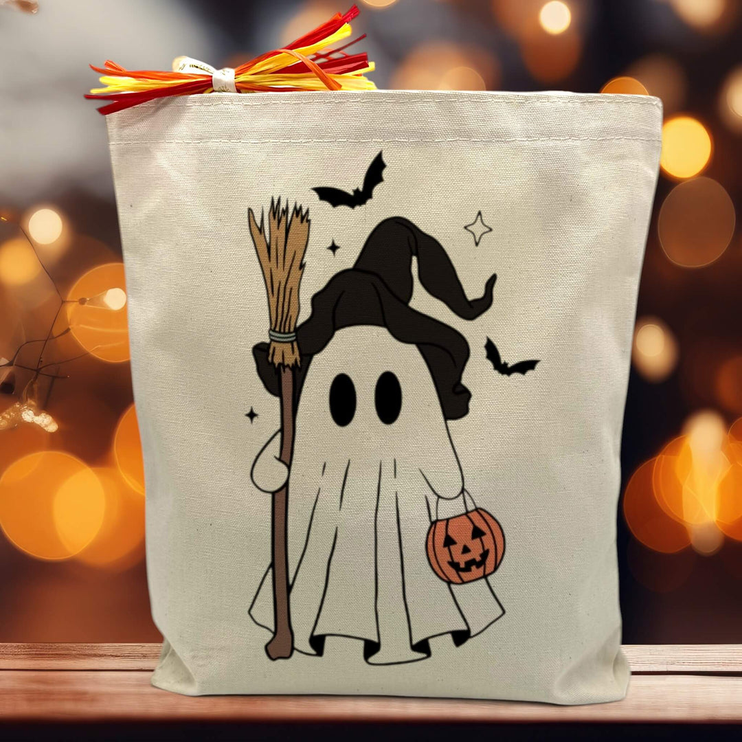 Halloween ghost printed on a canvas tote bag sitting on a table