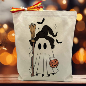 Halloween ghost printed on a canvas tote bag sitting on a table