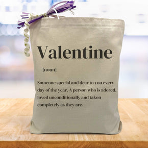 valentine definition printed on a canvas tote bag sitting on a table