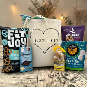 Gourmet anniversary gift basket with pretzels, chocolate bar, caramels, cookies and trail mix