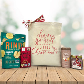 Gourmet holiday gift basket with apple chips, chocolate bar, apple pie tea and cheery buds