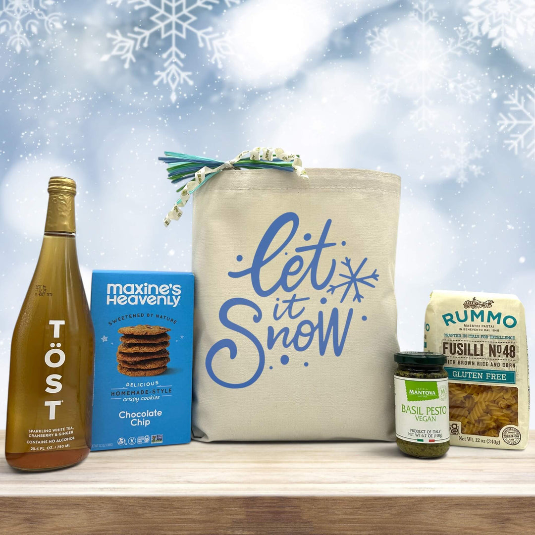 Gourmet holiday gift basket with sparking juice, chocolate chip cookies, pesto, and pasta