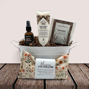 small white tin tub with a calming spirtz, lotion, bathtub tea and an eye pillow