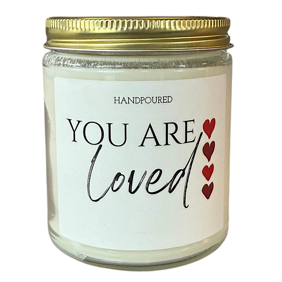 you are loved print with 4 red hearts to the side printed on a candle
