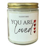 you are loved print with 4 red hearts to the side printed on a candle
