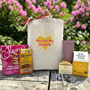 gift with cookies, chocolate bar, soap, lotion, and tea